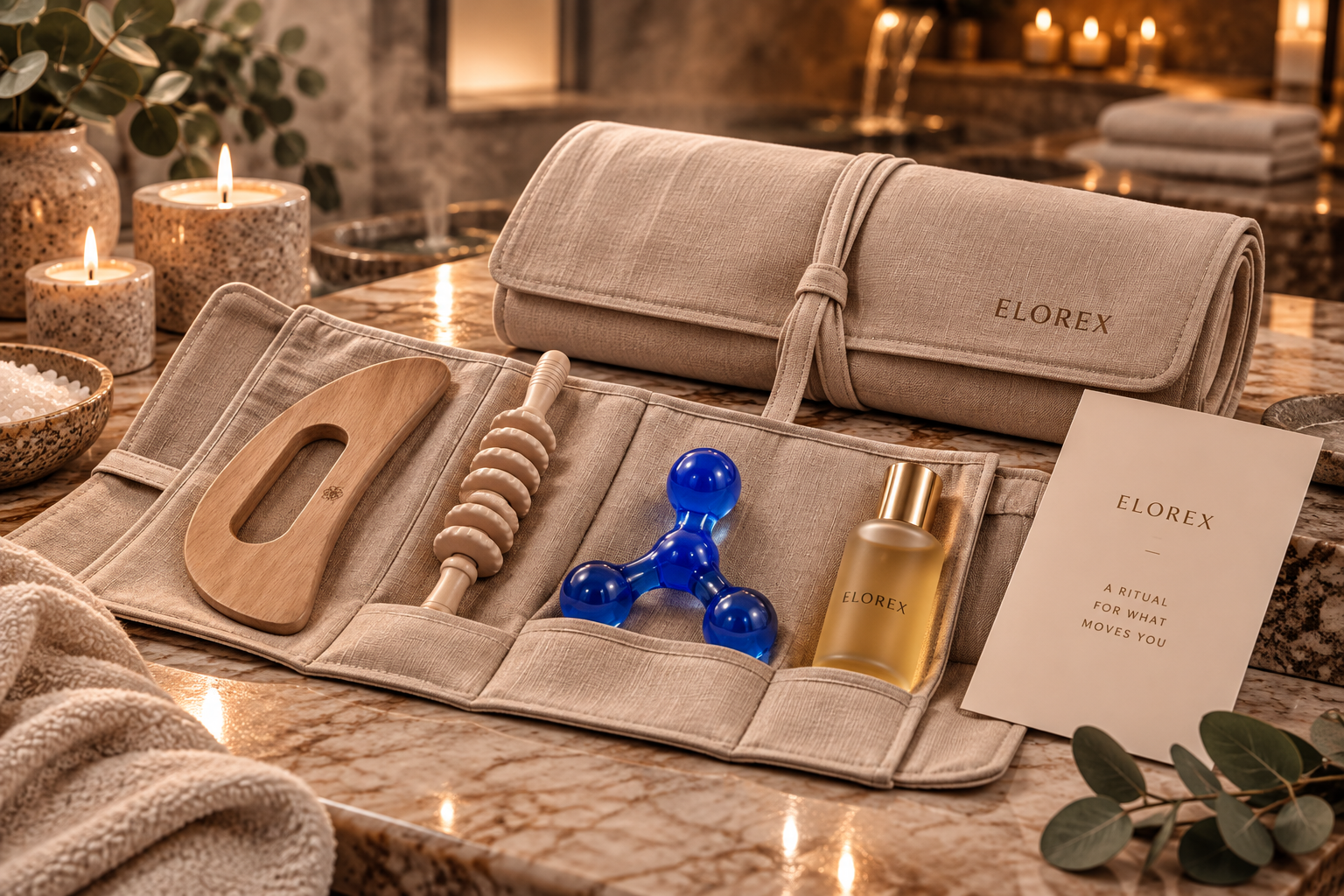 An Elorex linen roll open to a wooden gua sha, a pressure-point massage tool, a wooden roller and a body oil, beside a ritual card